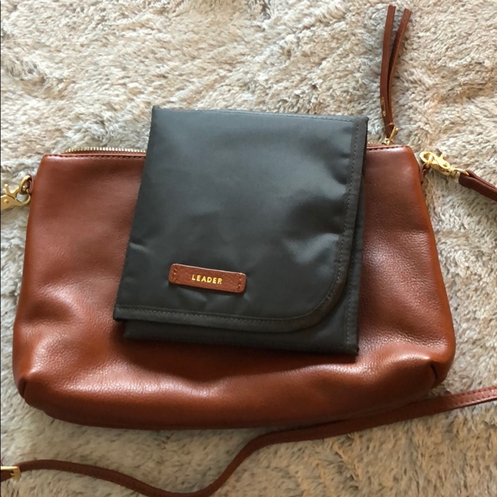 Leader leather crossbody changing bag. New!